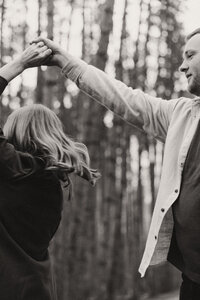 Man twirls fiance around