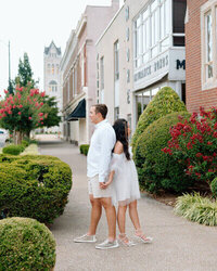 Couple leaning back to back taken by nashville engagement photographer