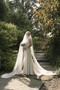 Bride having a quite moment in the garden