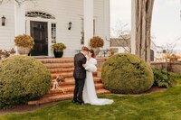 Newlyweds Embracing on the Stairs | Photography by Jocelyn