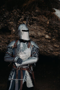 bride and groom reach for each other and barely touch at sand dunes in Nevada