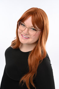 business professional in a suit top getting professional headshot