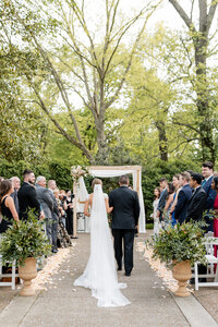 couple embracing in front of building