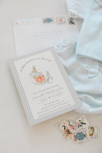 flatlay of invitation suite at Cake Bake baby shower in Carmel, Indiana