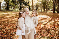 Kate and her two daughters during their family photoshoot in autumn with auckland photographer michelle kelly