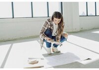 woman posing by windows