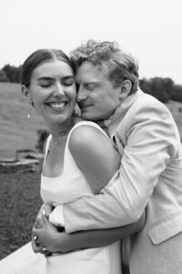 newly wed couple hugging, candid wedding photography