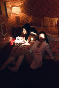 editorial photo shoot with two women in a bedroom