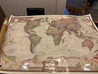 Vintage-inspired world map art being framed for a custom dining room in Peoria, AZ