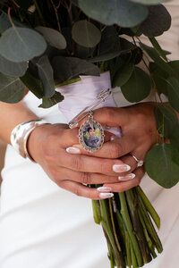 Close-up of a wedding bouquet with flowers and greenery, captured by Lamblight Photography in Utah