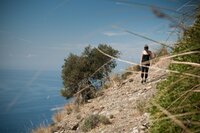 Woman hiking along Italian Riviera to San Fruttuoso