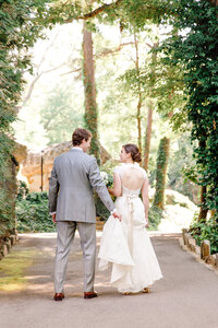 Bride and groom walk up memorial steps at their DC wedding