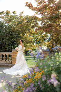 Bride surrounded by flowers he Cairnwood  Estate in Philadelphia, PA
