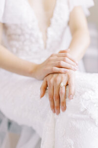 close up detail photography of a brides folded hands on her Calgary wedding day