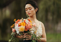 Asian Bride holding bridal bouquet