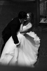 couple kissing on their wedding day