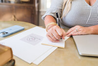 Erynn writing at desk