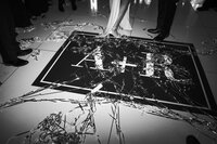 Black and white image of the dance floor at a Dallas wedding at The Thompson Hotel