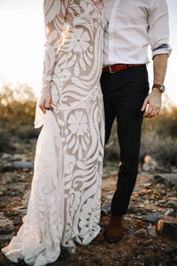 bride and groom in desert