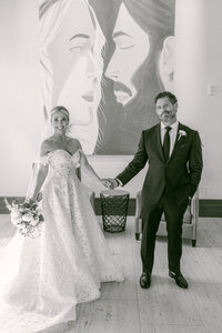 Bride and groom walk up memorial steps at their DC wedding