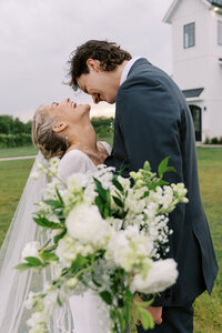 bride and groom hugging