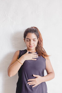 Woman taking calming deep breaths