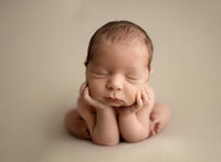 Baby Boy in froggy pose. Photographed by Atlanta Newborn Photographer at Woodstock photography studio.