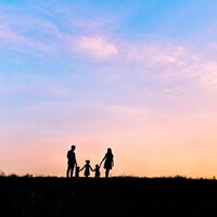 Utah Wedding Photographer captures family holding hands during sunset photos