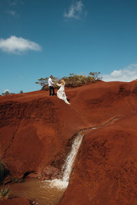 Maui Elopement Photographer captures bride and groom walking together after maui elopement packages