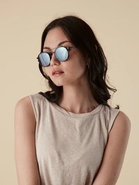 Brand photograph of a female model wearing Childe unisex butterfly design Sunglasses