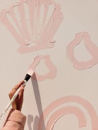 hand painting shells and abstract shapes with pink paint