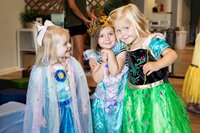 Toddlers at the Nest, a preschool in Surf City, NC posing together in their princess dress up costumes