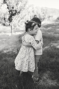two kids hugging