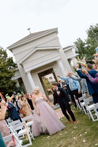 couple walking back down the aisle after ceremony at huntsville botanical gardens