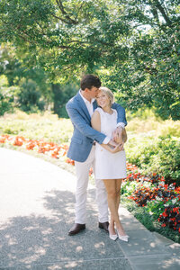 Husband spins his wife in the park