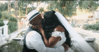 A black bride and hispanic groom sharing a romantic kiss in Temecula, California.