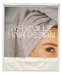 woman with shower towel on her head and logo of Asheville Hair Design