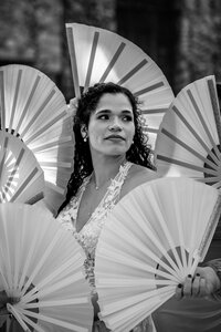 Bride preparing for her luxury San Antonio wedding by hanging her dress in a window, captured by CMH Studios.