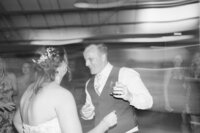 bride and groom kissing under veil