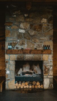 Rustic fireplace in a cozy home in Pincher Creek, Southern Alberta