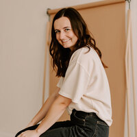A professional headshot of Jordin Brinn, owner of Unica Formo, the website design agency known for creating beautiful, functional websites.
