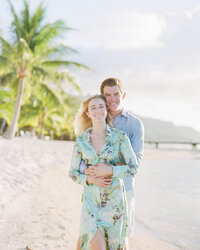 The bride and the groom with the vibrant colors of the lagoon in Moorea