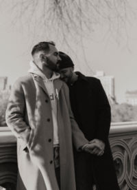 A couple holding hands outside on a Fall day