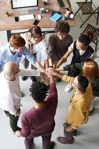 Image of team with their hands in a circle