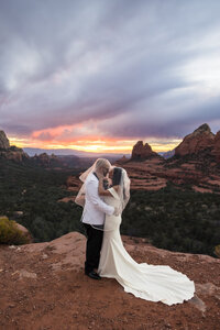 bride and groom under veil in Sedona