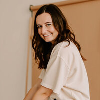 A professional headshot of Jordin Brinn, owner of Unica Formo, the website design agency known for creating beautiful, functional websites.