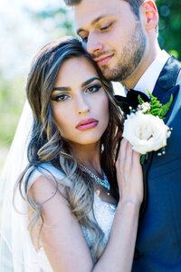 Bride leaning on his chest  — captured by Minnesota wedding photographer.