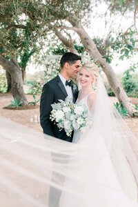 bride and groom smiling