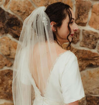 Bride in veil looking back