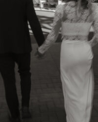 Laughing couple exchanging vows with red rock formations in Sedona as the backdrop